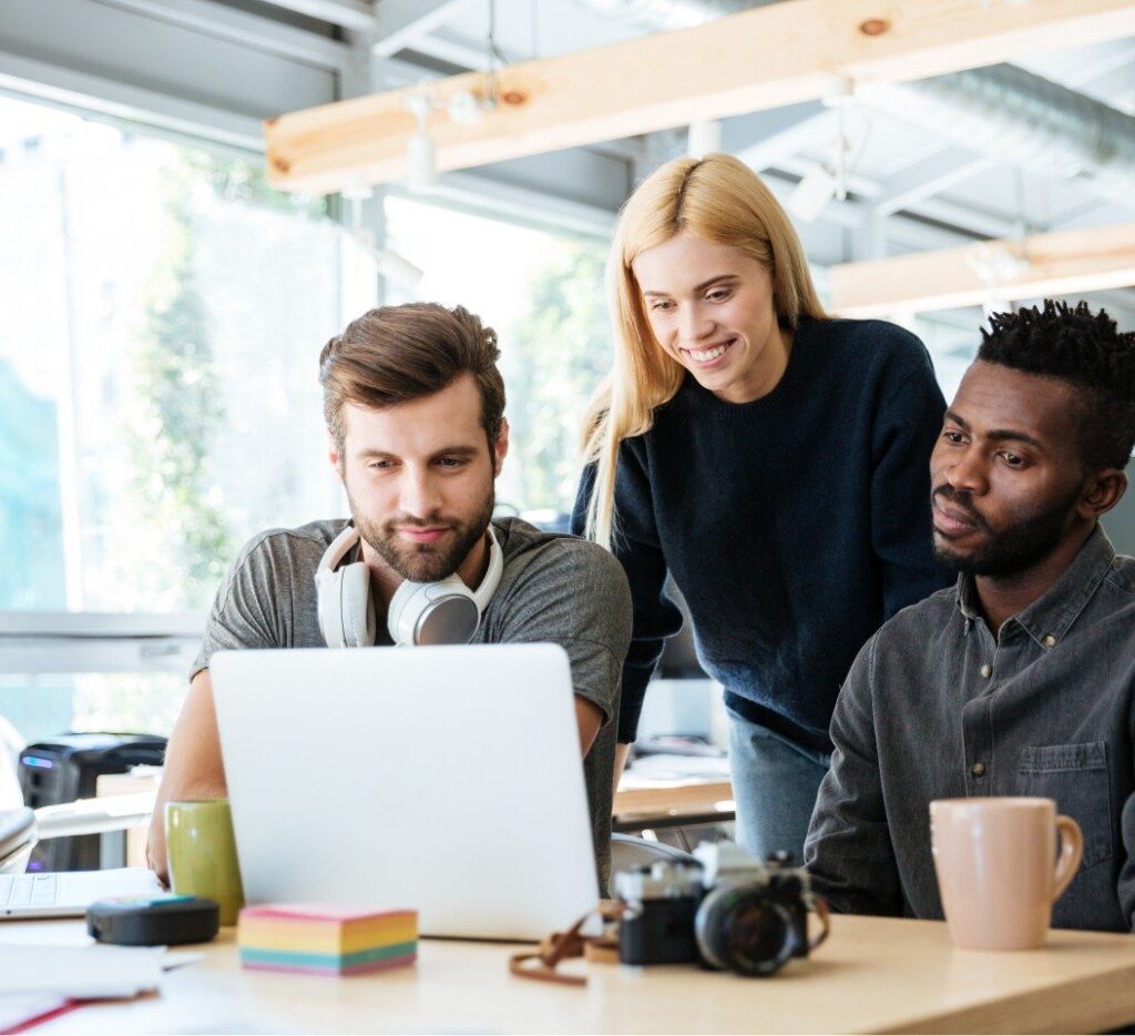 demo-attachment-335-happy-colleagues-sitting-in-office-coworking-PHYA6TG